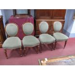 A Set of Four XIX Century Walnut Chairs, with upholstered backs and seats, on turned and reeded