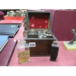 An Early XIX Century Mahogany Inlaid Apothecary Box, the compartmented interior with six bottles (