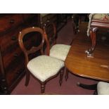 A Set of Seven XIX Century Mahogany Dining Chairs, with shaped centre rail, upholstered seats, on