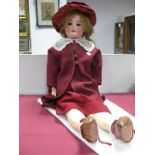 An Early XX Century Large Bisque Headed Doll, the head stamped "Simon Halbig 1906/9", sleepy eyes,