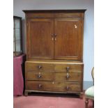 An Early XIX Century Oak Linen Cupboard, with stepped pediment, panel doors, two dummy drawers,