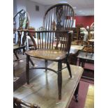 A XIX Century Yew Wood Windsor Chair, with hooped back, pierced splat and rail supports, elm seat,