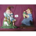 A Pair of Late XIX Century Cast Iron Door Stops in the Form of Punch and Judy, upon shaped and