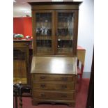 An Early XX Century Oak Bureau Bookcase, with leaded glazed doors, fall front, fitted interior,