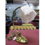An Early XX Century Brass Desk Lamp, with adjustable joint, with mottled pink glass shade, 42cm