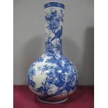 An Early XX Century Japanese Bottle Vase, painted in blue with a flowering peony tree, within