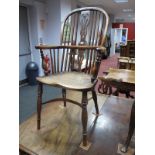 A XIX Century Yew Wood Windsor Chair, with hooped back, rail supports, pierced splat, elm seat, on