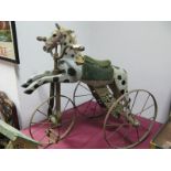 A Large Wooden Velocipede Tricycle, in the form of a horse, cast frame, spoked wheels, 65cm high.