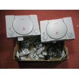 Two Playstations PS1, consoles, hand controllers among associated items.