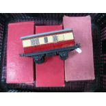 Four Hornby 'O' Gauge Coaches, three No 51 (blood and custard), includes guard coach, two boxed (one