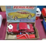 A Plastic Remote Control Ferrari by Fairylite, finished in red, body appears unbroken, boxed wear to