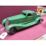 A Mid XX Century Pressed Steel Clockwork Car By Marx, finished in green, 'siren police car',