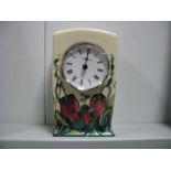 A Moorcroft Pottery Clock, painted in the Pretty Penny pattern, designed by Rachel Bishop, painted