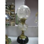 A Late XIX Century Oil Lamp, with glass funnel, engraved glass shade, well, brass pedestal,