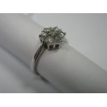 A Modern Diamond Cluster Dress Ring, claw set with brilliant cut stones, stamped "375"