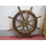 A Reproduction Stained Hardwood Ships Wheel, diameter 69cm.