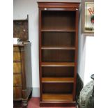 A Mahogany Bookcase, with reeded side of four adjustable shelves on a plinth base.