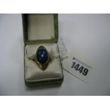 A Modernist Lapis Lazuli Set Dress Ring, stamped "18K".