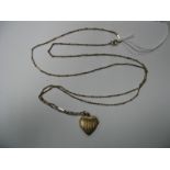 A Long Fancy Link Chain, suspending engine turned heart shape locket pendant.