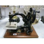 A Willcox & Gibb Sewing Machine, circa late XIX Century with stamp to cradle and circular plaque