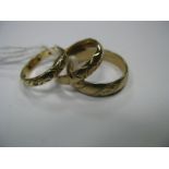 A 9ct Gold Patterned Wedding Band; together with two 9ct gold patterned wedding bands. (3)