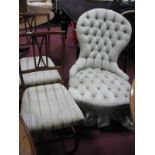 A XIX Century Walnut Framed Parlour Chair, with spoon back, upholstered in a button back fabric; a