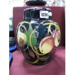 A Moorcroft Pottery Ginger Jar, painted in the Queens Choice pattern designed by Emma Bossons, shape