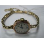 A 9ct Gold Cased Ladies Wristwatch, on 9ct gold expanding bracelet.