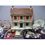 A Mid XX Century Dolls House, together with dolls furniture.