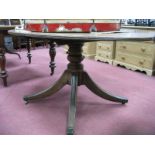 A XIX Century Mahogany Occasional Table, with oval top, reeded edge, on turned pedestal with splayed