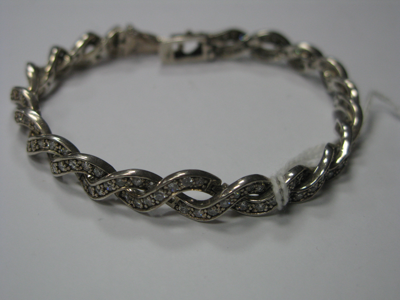 A Modern CZ Set Bracelet, of uniform twisted deisgn, to snap clasp, stamped "925".