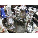 A Mappin & Webb Egg Cruet, Viners three piece plated tea service, two plated circular trays,
