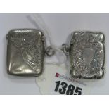 A Hallmarked Silver Vesta Case, leaf scroll engraved; together with another example. (2)