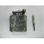 A Continental Lighter, detailed in relief with dancing figures within a rural setting (stamped "