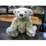 A Modern Steiff Teddy Bear, with poseable arms and legs, glass eyes, button to ear, 50cm high