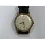 Record; A 9ct Gold Cased Gent's Wristwatch, the signed dial with Arabic numerals and seconds