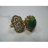 A Single Stone Dress Ring, high oval cabochon set; together with a decorative pierced panel ring (