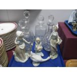 Four Lead Crystal Spirit Decanters, a Nao model of a young girl with butterfly and other models:-