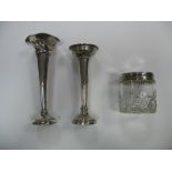 A Hallmarked Silver Topped Glass Tidy Jar, together with two hallmarked silver vases (damages). (3)