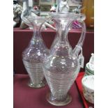 A Pair of XX Century Pearlescent Glass Ewers, each of ribbed design with circular rim and scroll