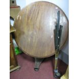 A XIX Century Mahogany Circular Tilt Top Table, on octagonal support and triform base; seven golf