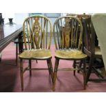 Three Ash and Elm Wheel Back Windsor Chairs, on turned legs, united by an H stretcher.