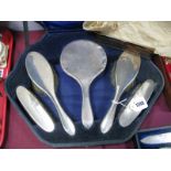 A Hallmarked Silver Backed Five Piece Dressing Table Set, each of plain design, with associated