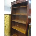 A Mahogany Bookcase, with reeded side, four adjustable shelves on a plinth base.