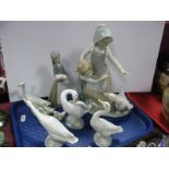 Lladro Model 'Avoiding the Goose', Lladro 'Girl with Piglet' and four Lladro goose models:- One