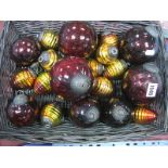 A Collection of Dark Red Crackle Type Glass Witches Style Balls, together with yellow/orange