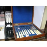 A Cased Set of Six Decorative Carved Handle Knives and Forks, (case lacking one tray); together with