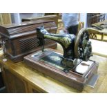 A Singer Sewing Machine, in mahogany case.