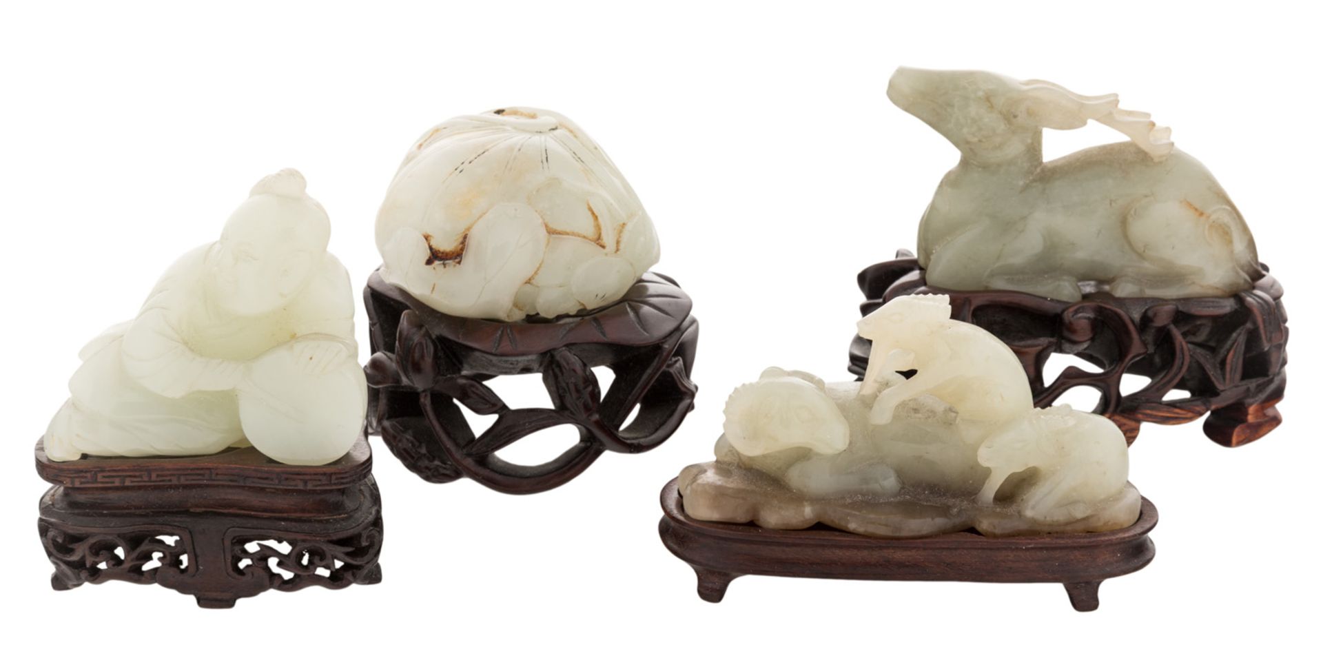 FOUR CHINESE WHITE JADE FIGURES ON STANDS (LATE QING DYNASTY)