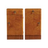 PAIR OF ART DECO SATIN WALNUT BEDSIDE PEDESTALS each with a drawer above a panelled door 66 cm.